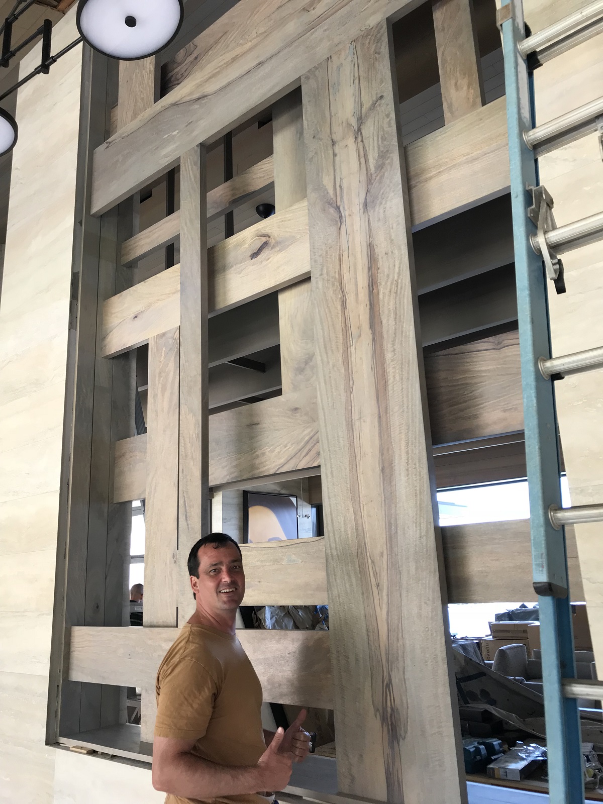 Robert standing close to a wooden structure